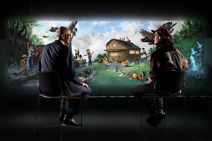 © Land Tirol/Christanell Mattle und Hecher vor Bild sitzend