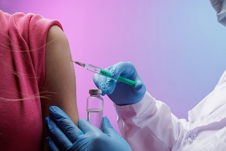 © 2640325971 Doctor,In,Gloves,Giving,A,Vaccine,Injection,To,A,Patientís