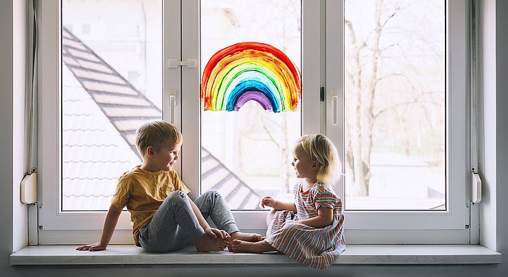 Little,Children,On,Background,Of,Painting,Rainbow,On,Window.,Photo