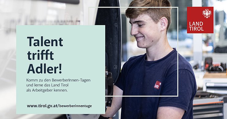 Ein Lehrling schraubt an einem Auto