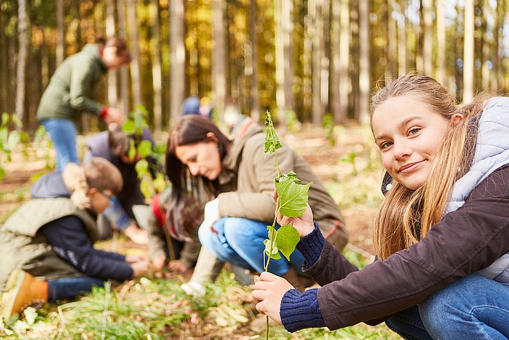 Girl,Plants,A,Tree,Seedling,As,A,Climate,Change,Tree